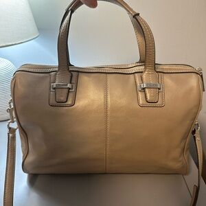Coach leather handbag champagne color with handles and cross body strap
